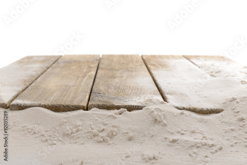 Sand with wooden planks isolated on white