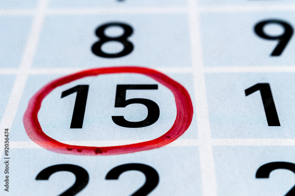 Day fifteenth of month highlighted by a red circle Day fifteenth of month highlighted by a red circle