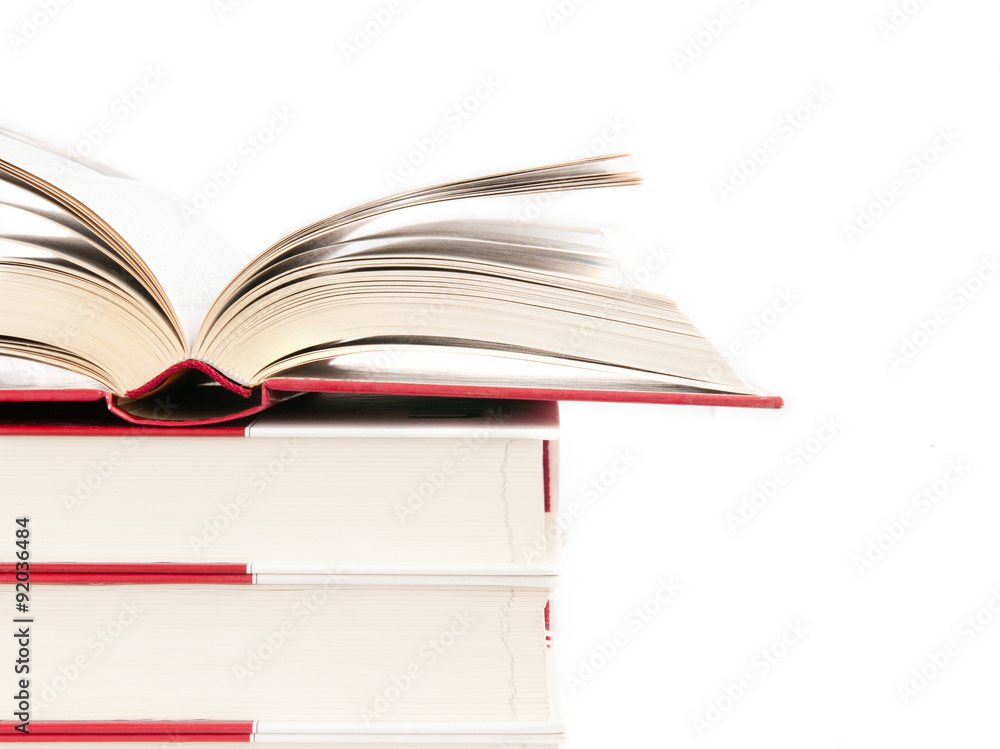 Open book on a stack of books Open book on a stack of books