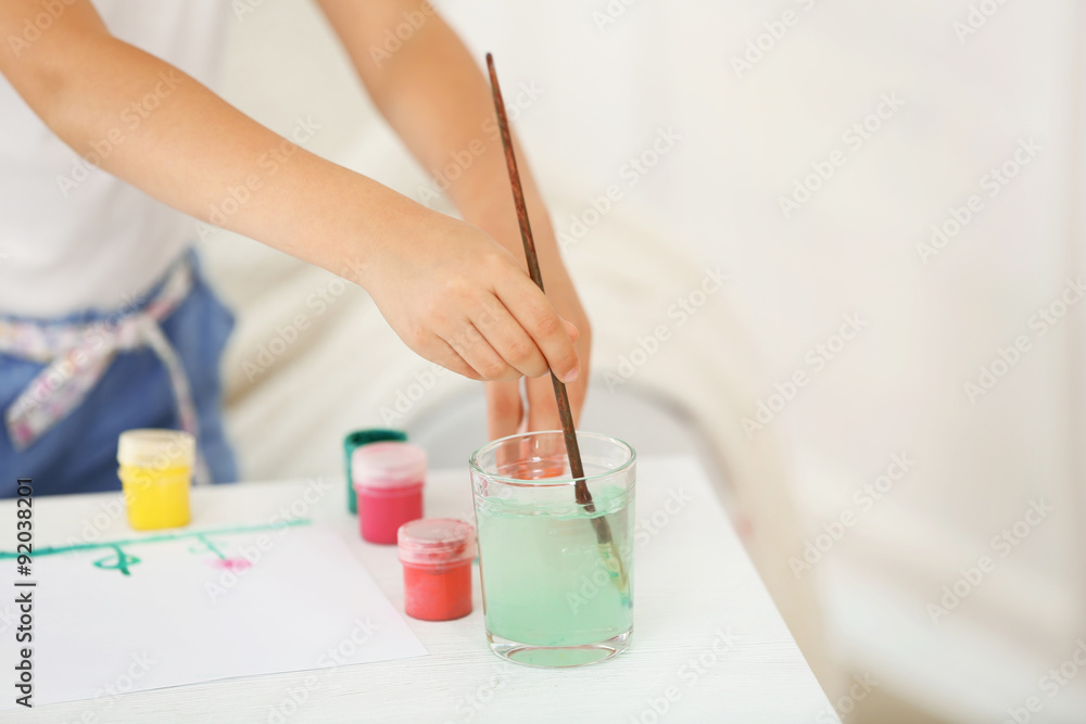 Cute little girl painting picture, close-up Cute little girl painting picture, close-up