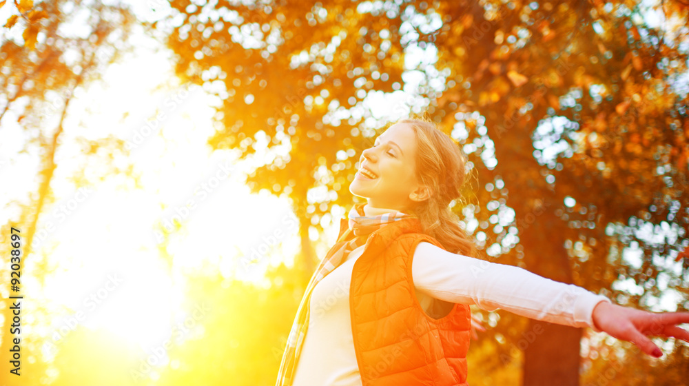 Happy Woman Enjoying Life in the Autumn on the Nature Stock Photo