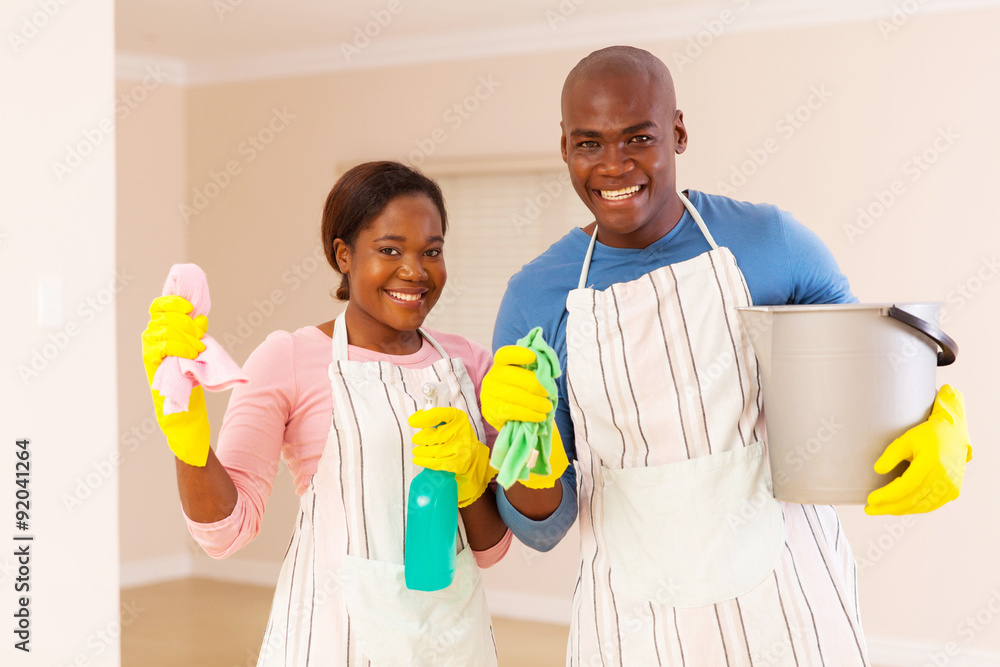 young african couple cleaning their new house young african couple cleaning their new house