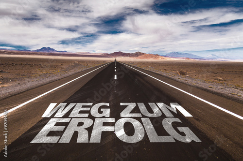 Road to Success (in German) written on desert road