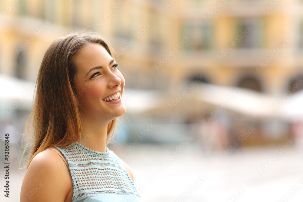 © Antonioguillem - Cheerful tourist woman looking at side in a touristic place © Antonioguillem - Cheerful tourist woman looking at side in a touristic place