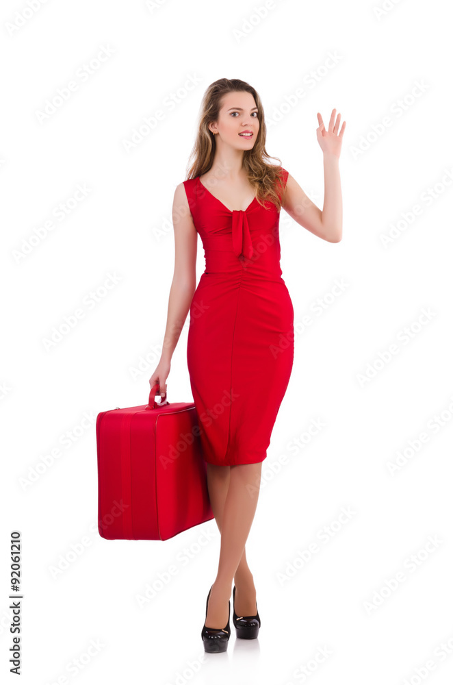 Young woman in red dress with suitcase isolated on white Young woman in red dress with suitcase isolated on white