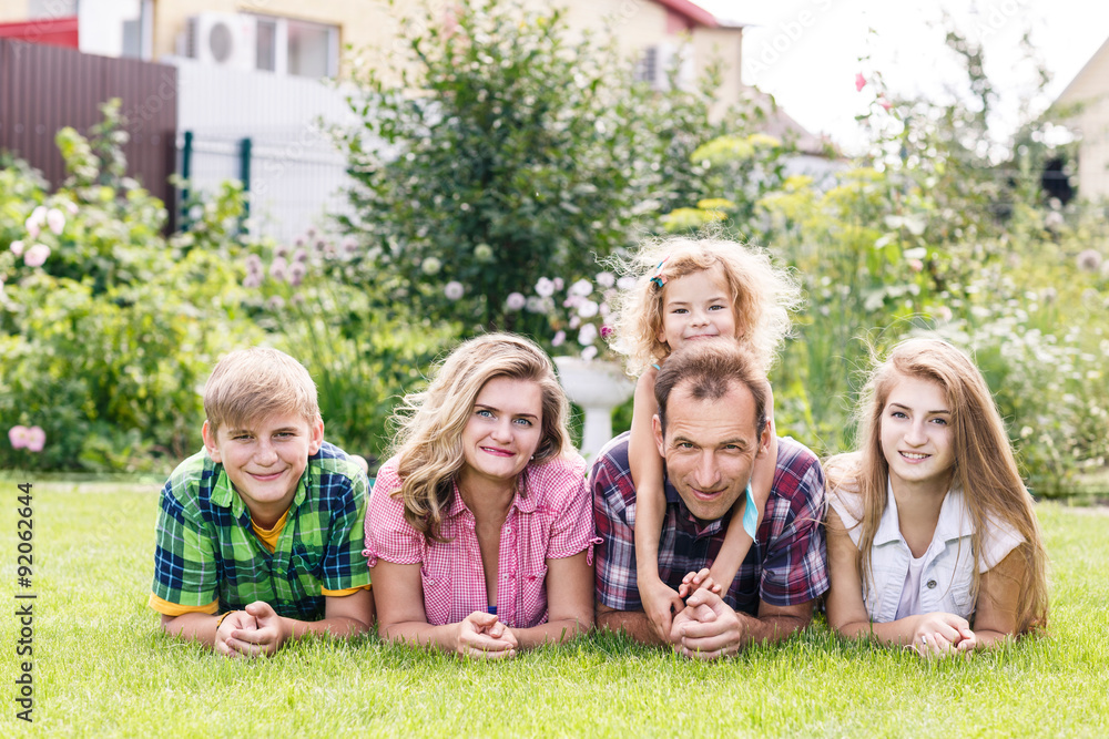 Happy family having weekend in summer park Happy family having weekend in summer park