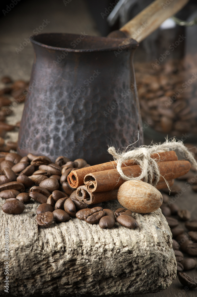 Fototapeta premium Coffee beans with spices and cezve