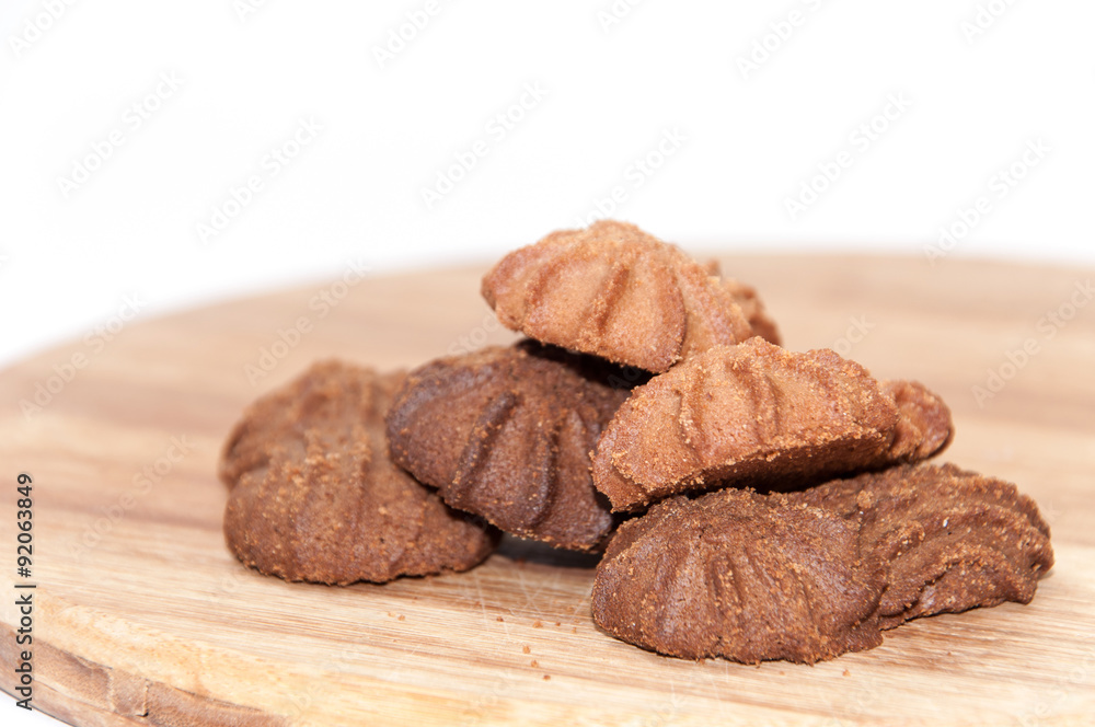 Brown chocolate cookies on the wooden board