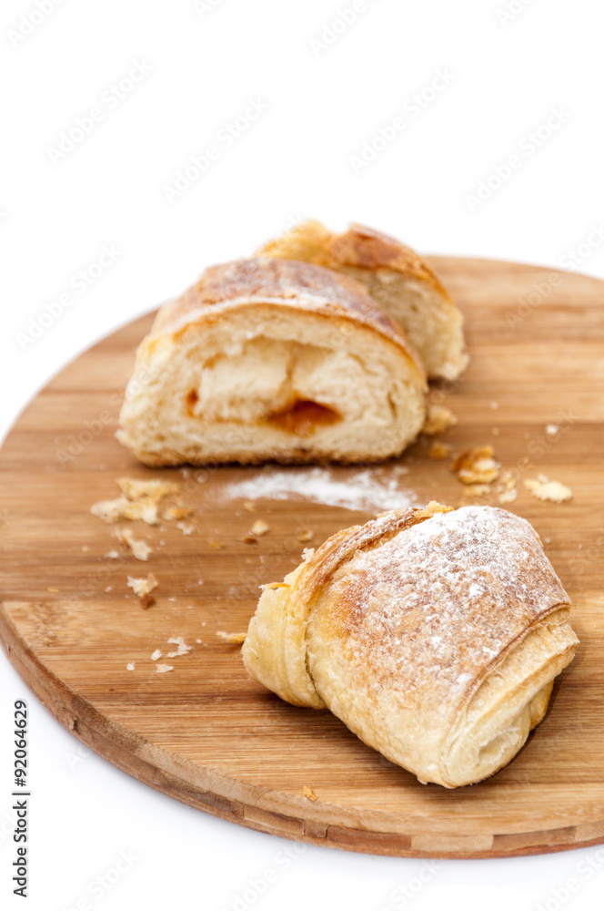 Piece of puff pastry on the wooden board