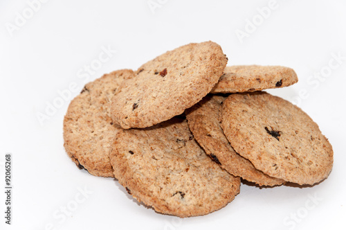 Pile of integral biscuits over white background
