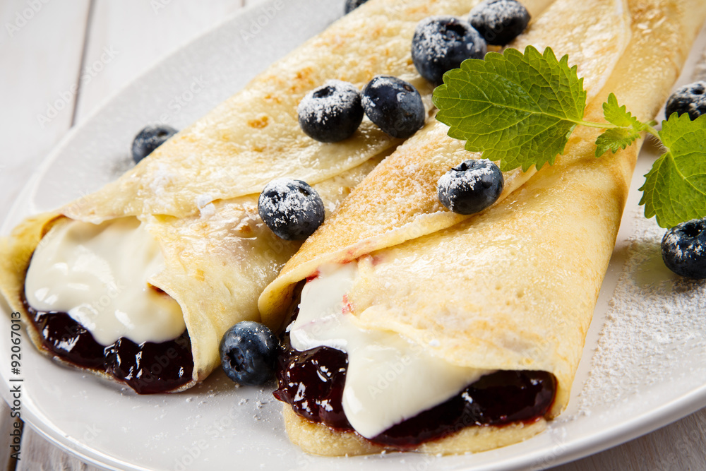 Crepes with blueberries and cream Crepes with blueberries and cream