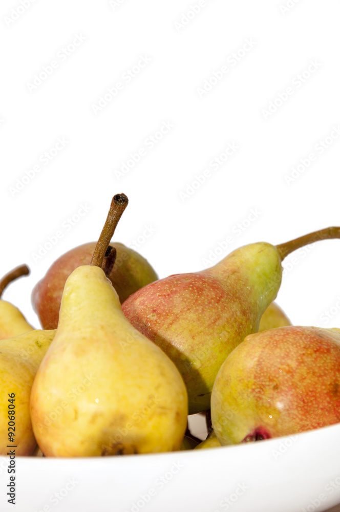 White bowl filled with fresh pears White bowl filled with fresh pears