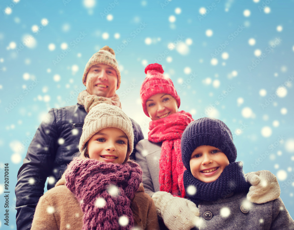 happy family in winter clothes outdoors