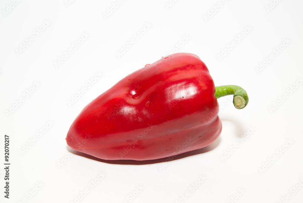 One ripe red peppers on over white One ripe red peppers on over white