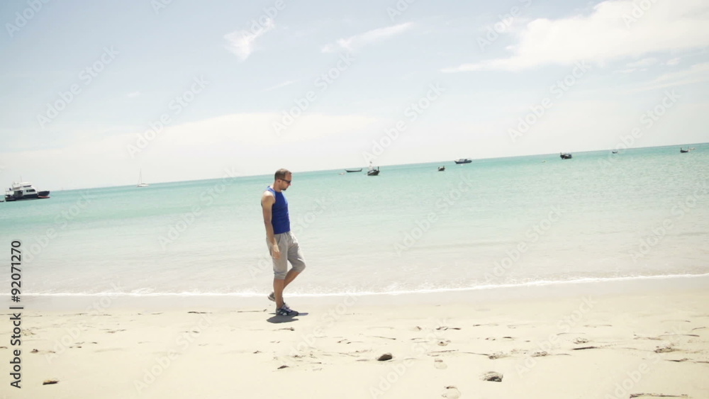 Young jogger walking on exotic beach, slow motion 240fps
Young jogger walking on exotic beach, slow motion 240fps