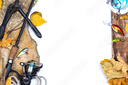 fishing tackles on stones with anchor and leafs