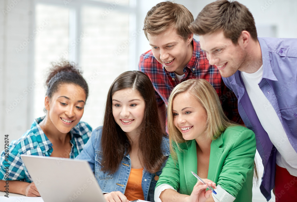 group of happy high school students with laptop group of happy high school students with laptop