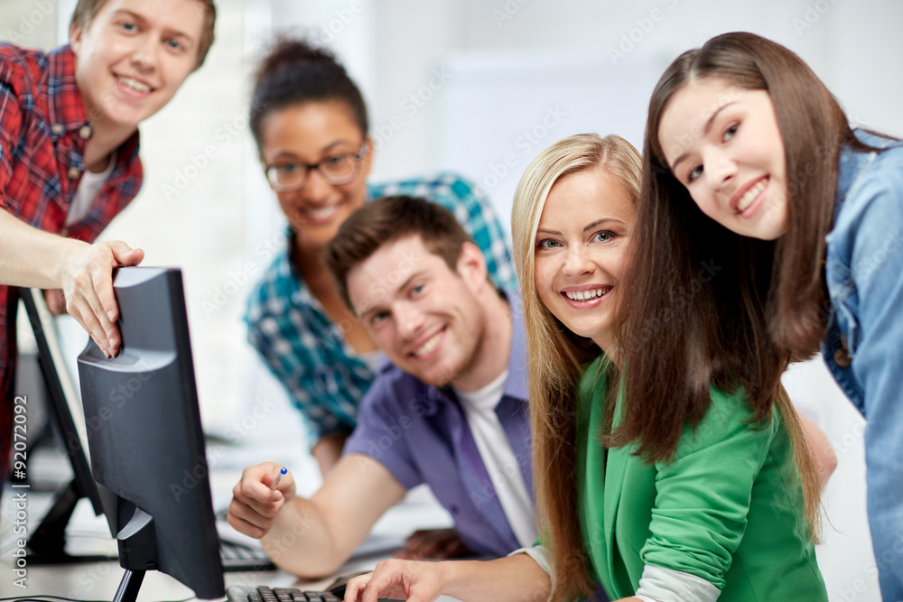 happy high school students in computer class