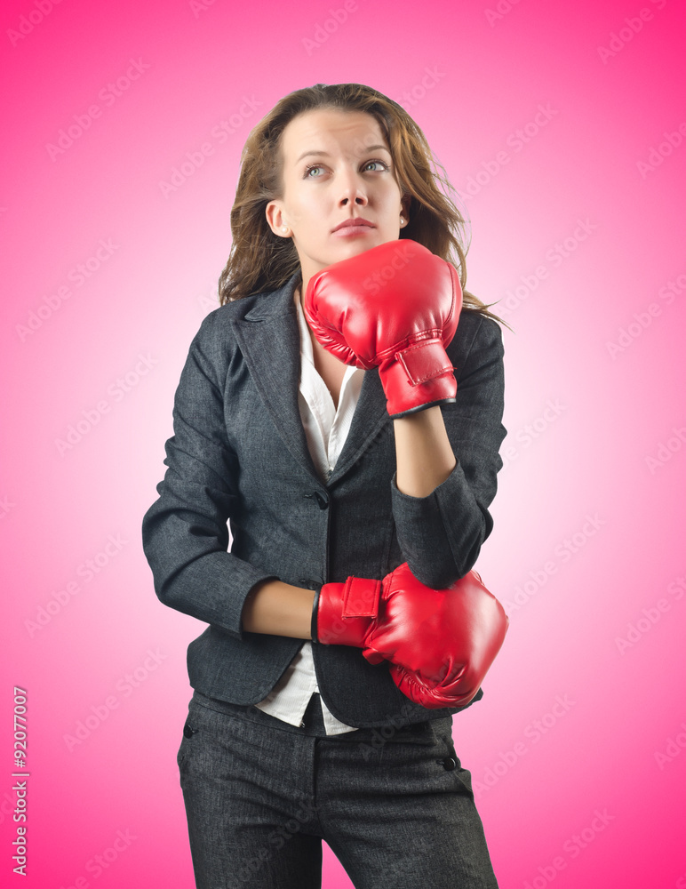 Young businesswoman in boxing concept Young businesswoman in boxing concept