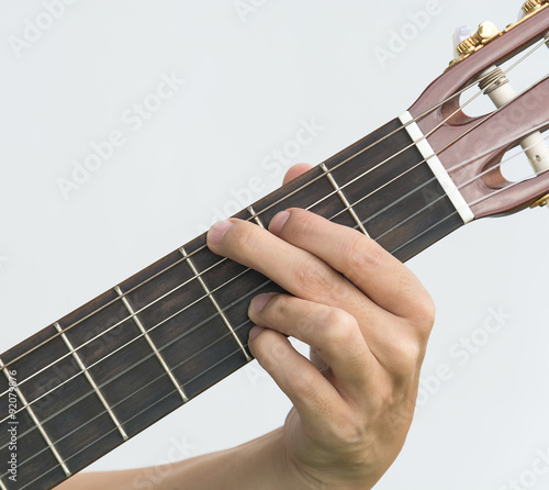  hand playing on guitar