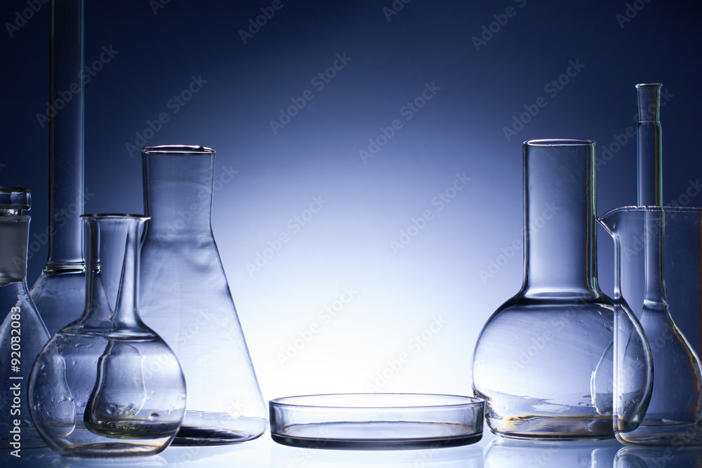 Assorted empty laboratory glassware, test-tubes. Blue tone medical background. Copy space Assorted empty laboratory glassware, test-tubes. Blue tone medical background. Copy space