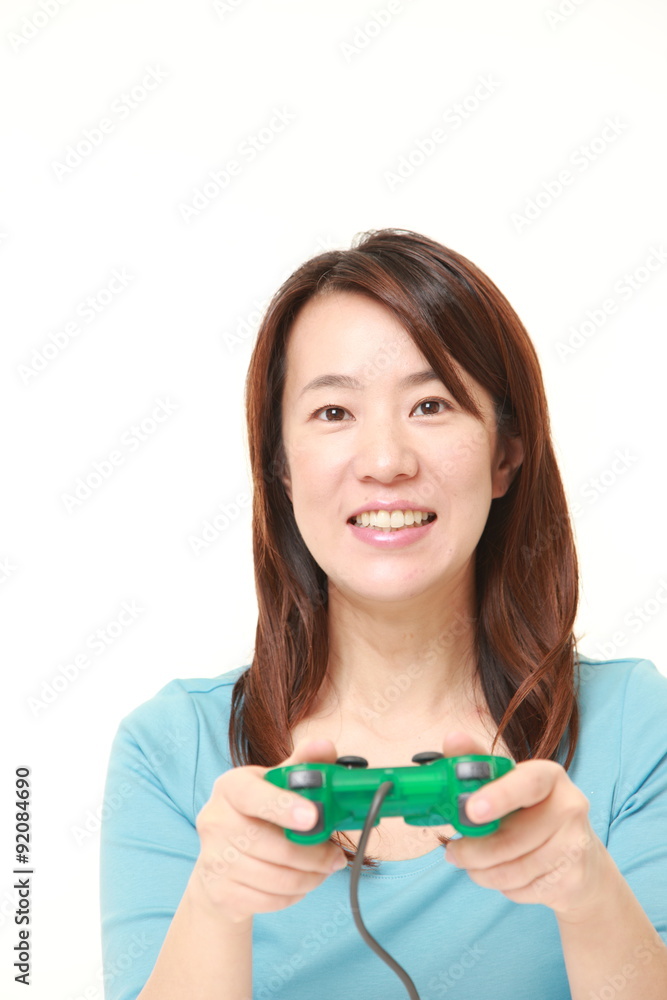 Japanese woman enjoying a video game Japanese woman enjoying a video game