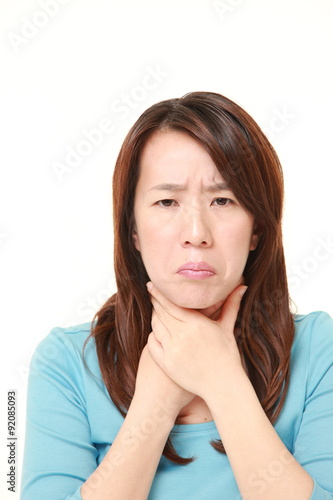 Japanese woman having throat pain