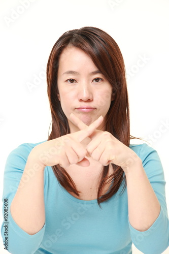 Japanese woman showing NO gesture