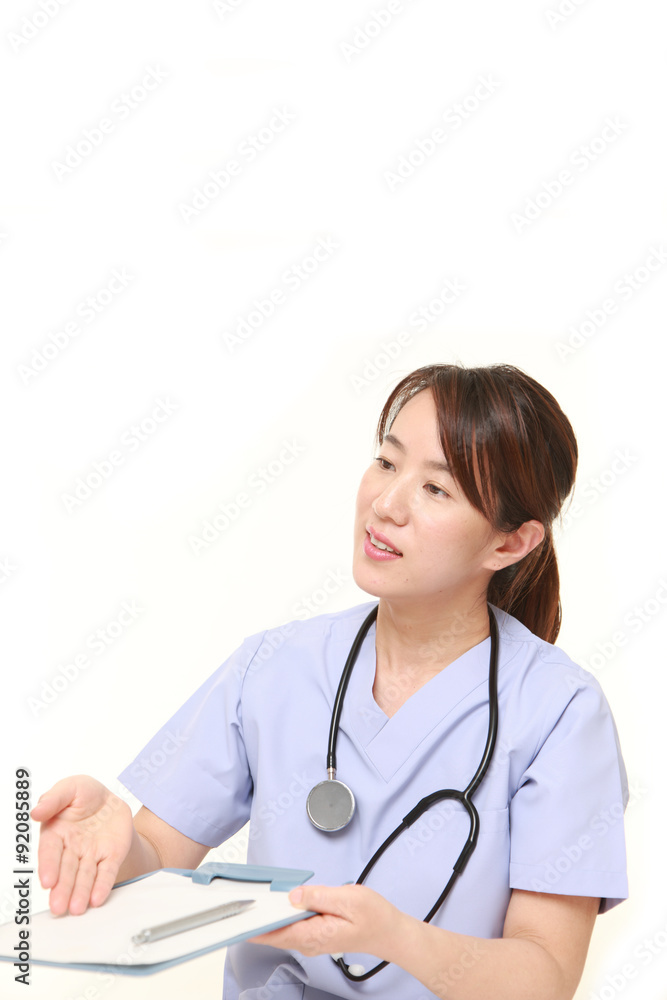 Japanese female doctor with medical interview sheet Japanese female doctor with medical interview sheet