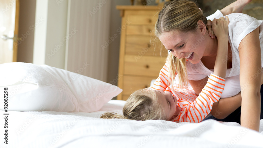 Mother and daughter playing at home Mother and daughter playing at home