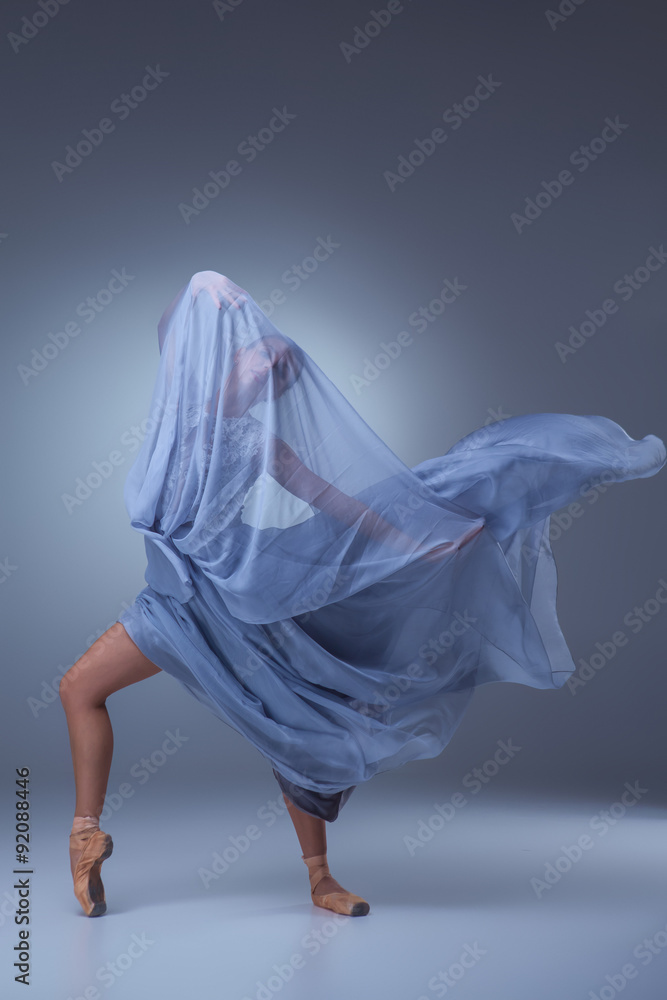 Fototapeta premium The beautiful ballerina dancing in blue long dress 