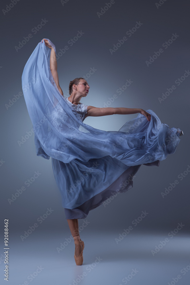 The beautiful ballerina dancing in blue long dress The beautiful ballerina dancing in blue long dress