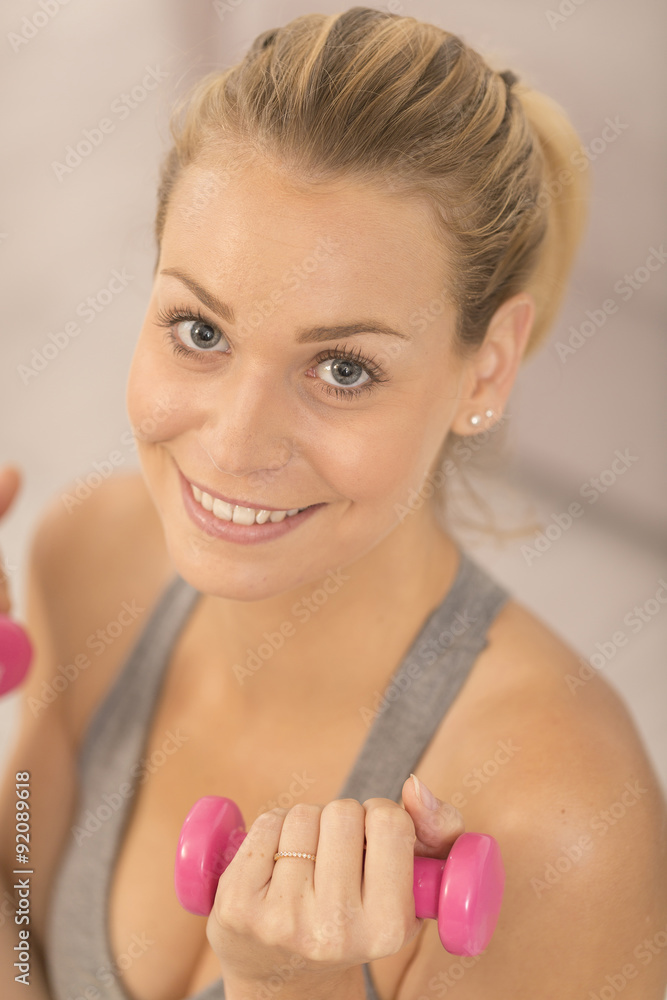 upper view of fitness girl holding dumbbells upper view of fitness girl holding dumbbells