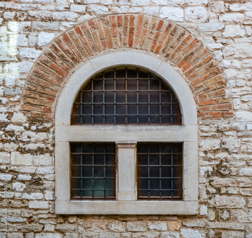 old window with metal bars 