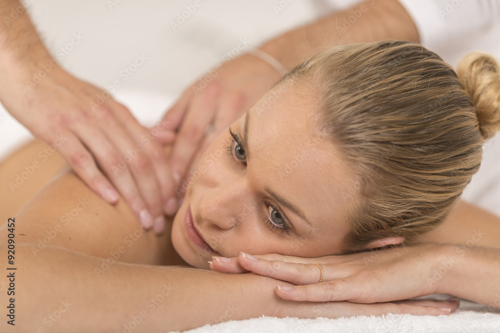 beautiful young woman relaxing in the spa salon