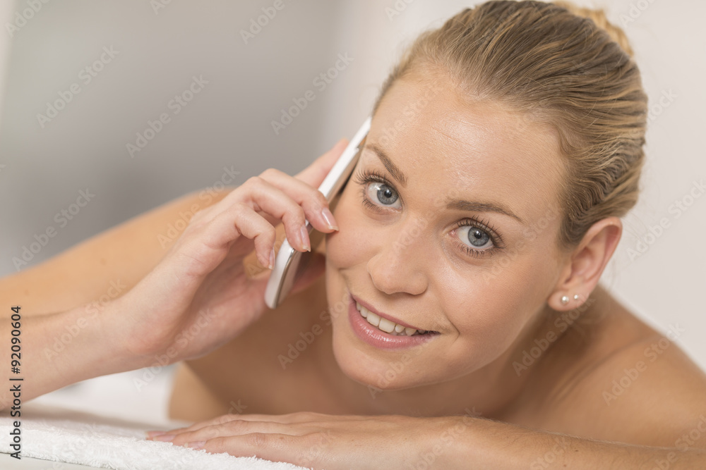 beautiful young woman relaxing in the spa salon