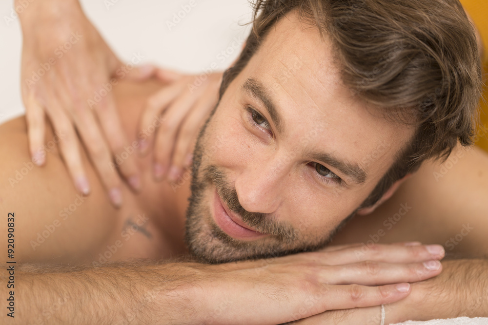 beautiful young man relaxing in the spa salon beautiful young man relaxing in the spa salon