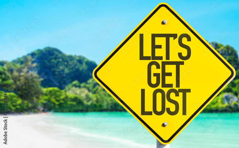 Lets Get Lost sign with beach background