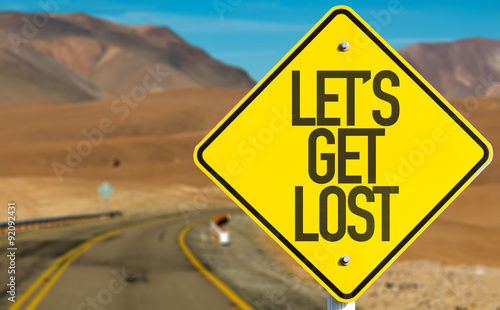 Lets Get Lost sign on desert road