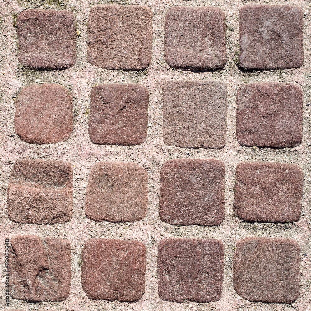 Obraz premium Small brown paves with pink joints