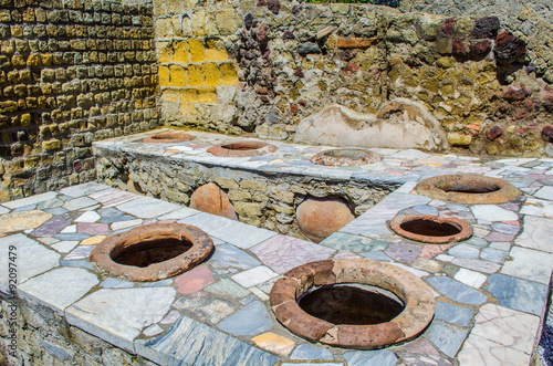 ruins of herculaneum destroyed by vesuvius volcano are less famous than ruins of pompeii, but nevertheless they also create compact area of former buildings attracting thousands of tourist every year