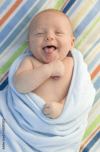 Laughing Baby Boy Wrapped i...