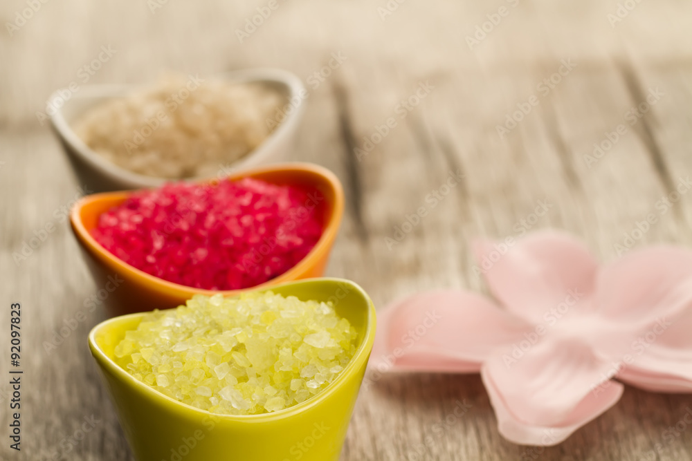 Colorful sea bath salts on wooden background. Spa, aromatherapy. Colorful sea bath salts on wooden background. Spa, aromatherapy.