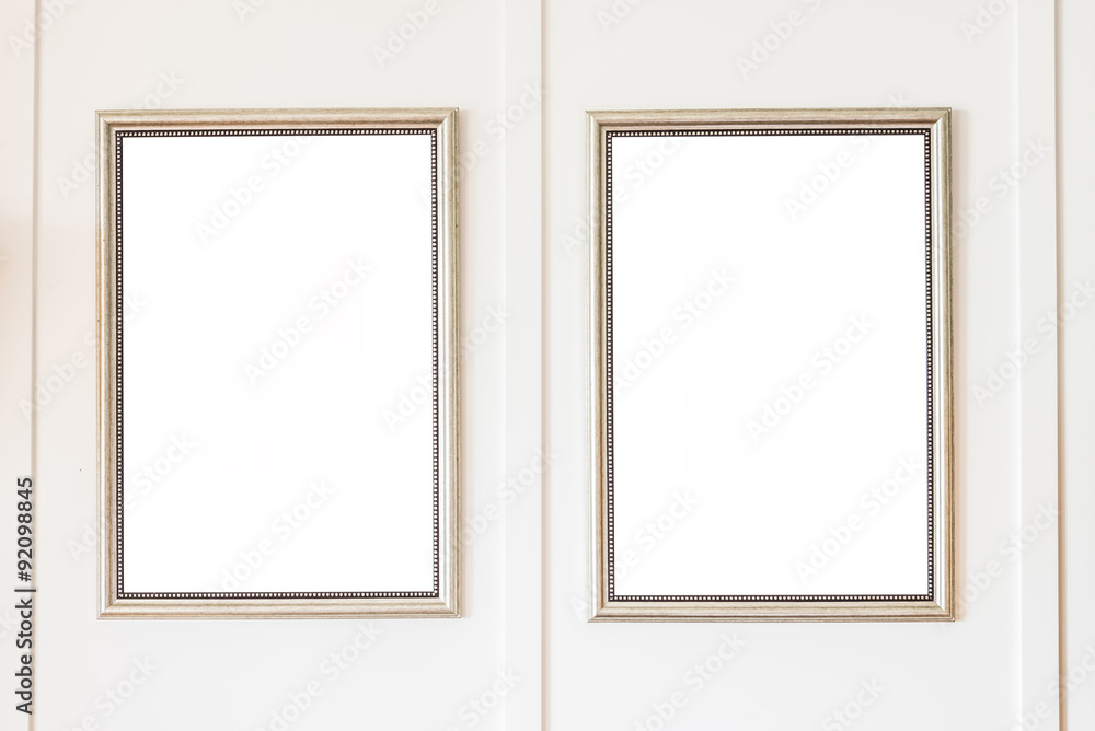 Blank frame on white wall background Blank frame on white wall background