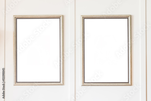 Blank frame on white wall background