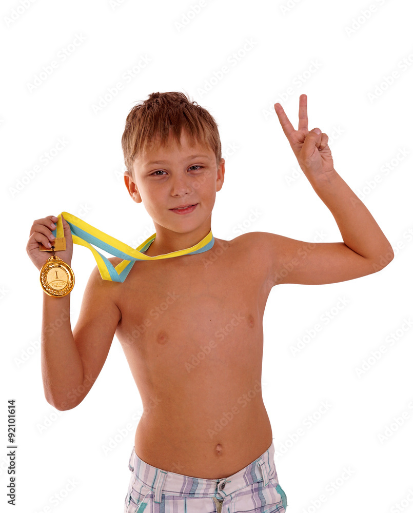 Sport success and win concept - smiling athlete champion child boy hand holding first place victory gold medal award Sport success and win concept - smiling athlete champion child boy hand holding first place victory gold medal award