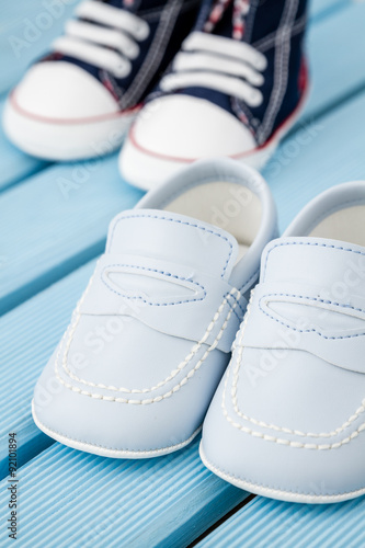 Pairs of Dark Blue, White Baby Sneakers and Blue Baby Shoes