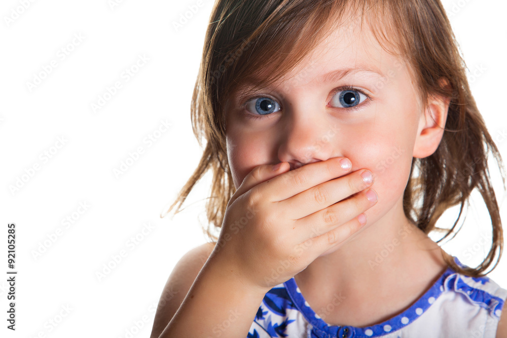 Portrait of a little girl who covered her mouth with hand Portrait of a little girl who covered her mouth with hand
