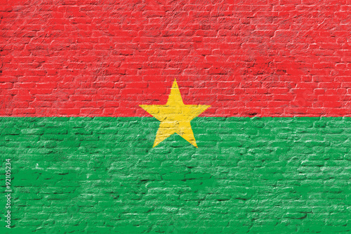 Burkina Faso - National flag on Brick wall