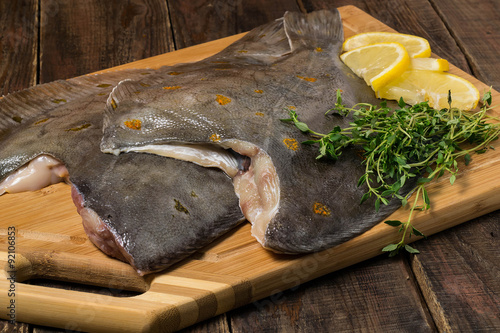Fotografia, Obraz Fresh flounder prepared for cooking